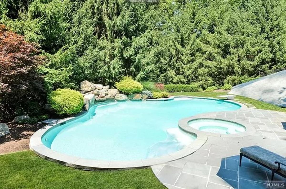 Pool with a lounge chair.