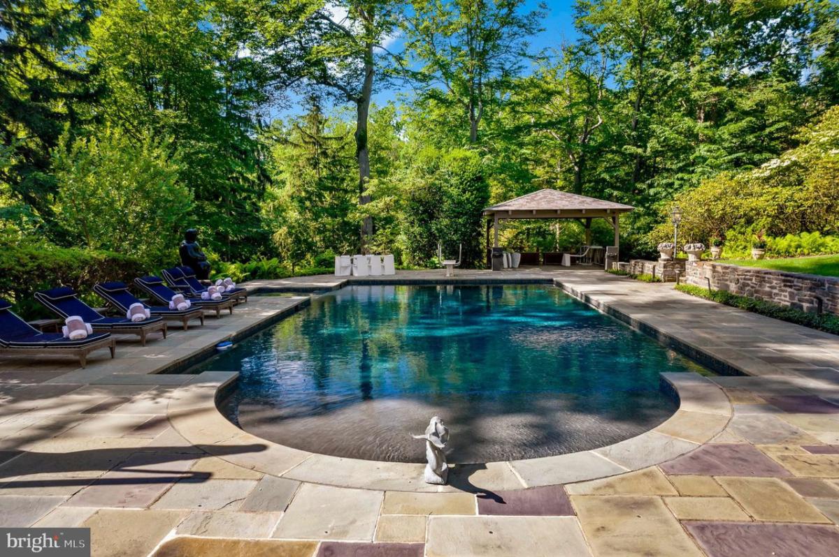 Pool with lounge chairs.