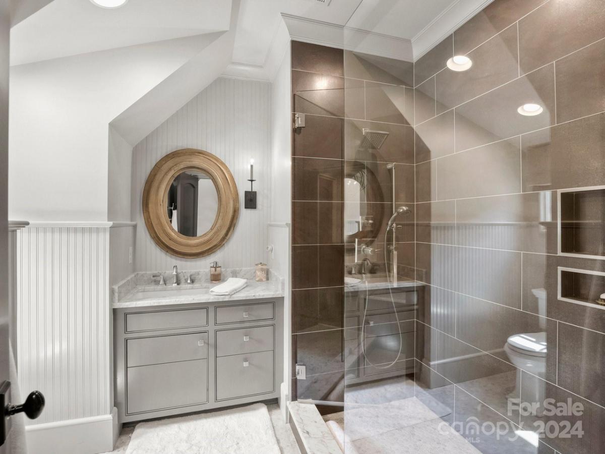 Bathroom with a sink and a walk-in shower.