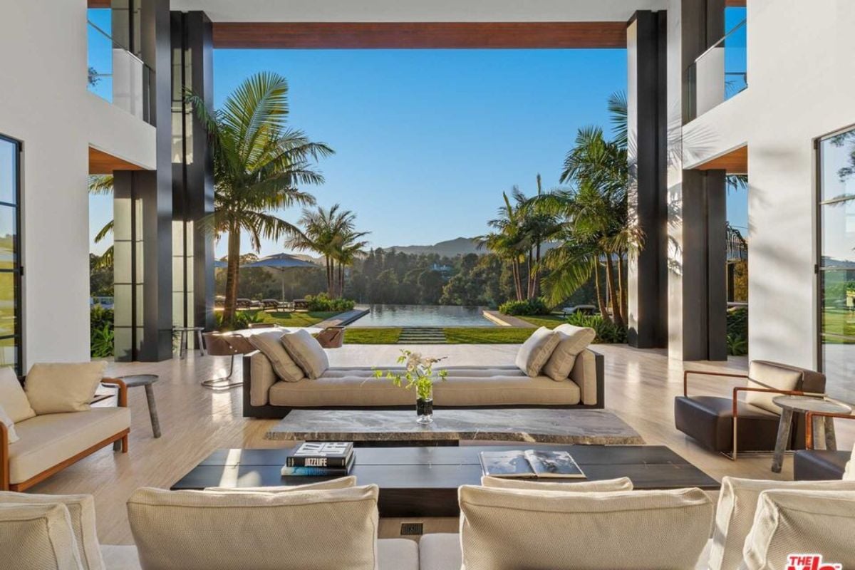 A living room with couches, chairs, and a center table.