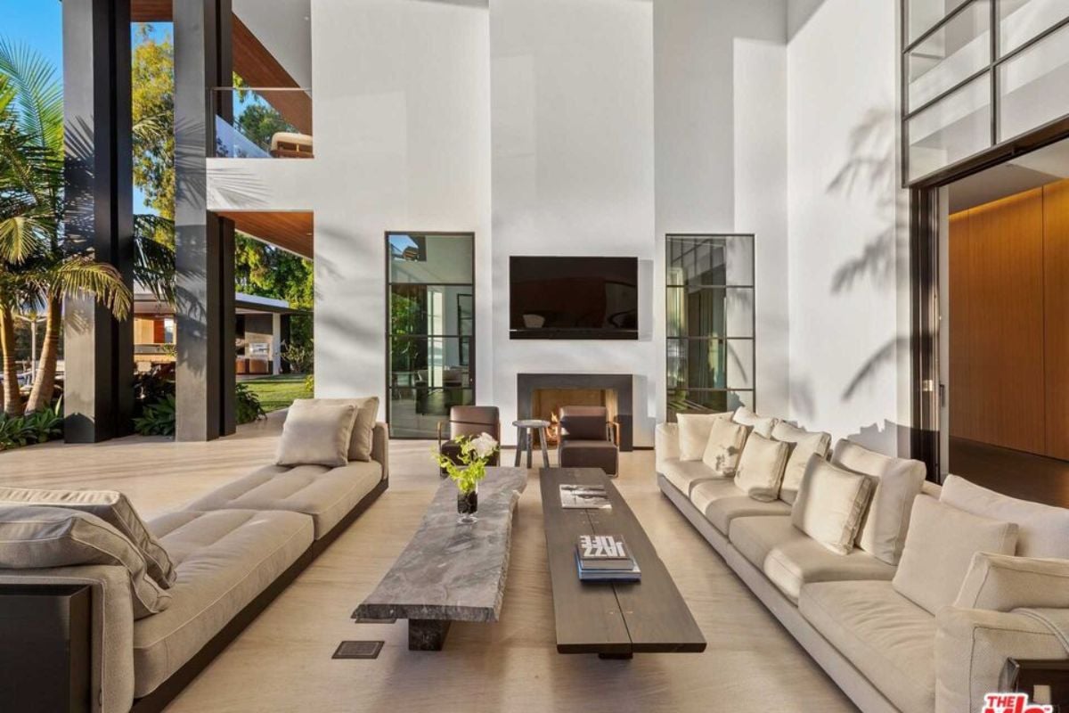 A living room with couches, chairs, and a center table.