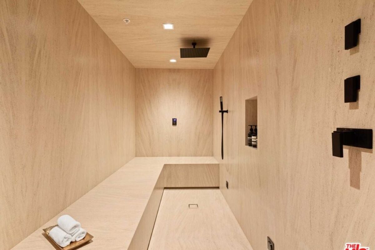 A sauna with a wooden bench.