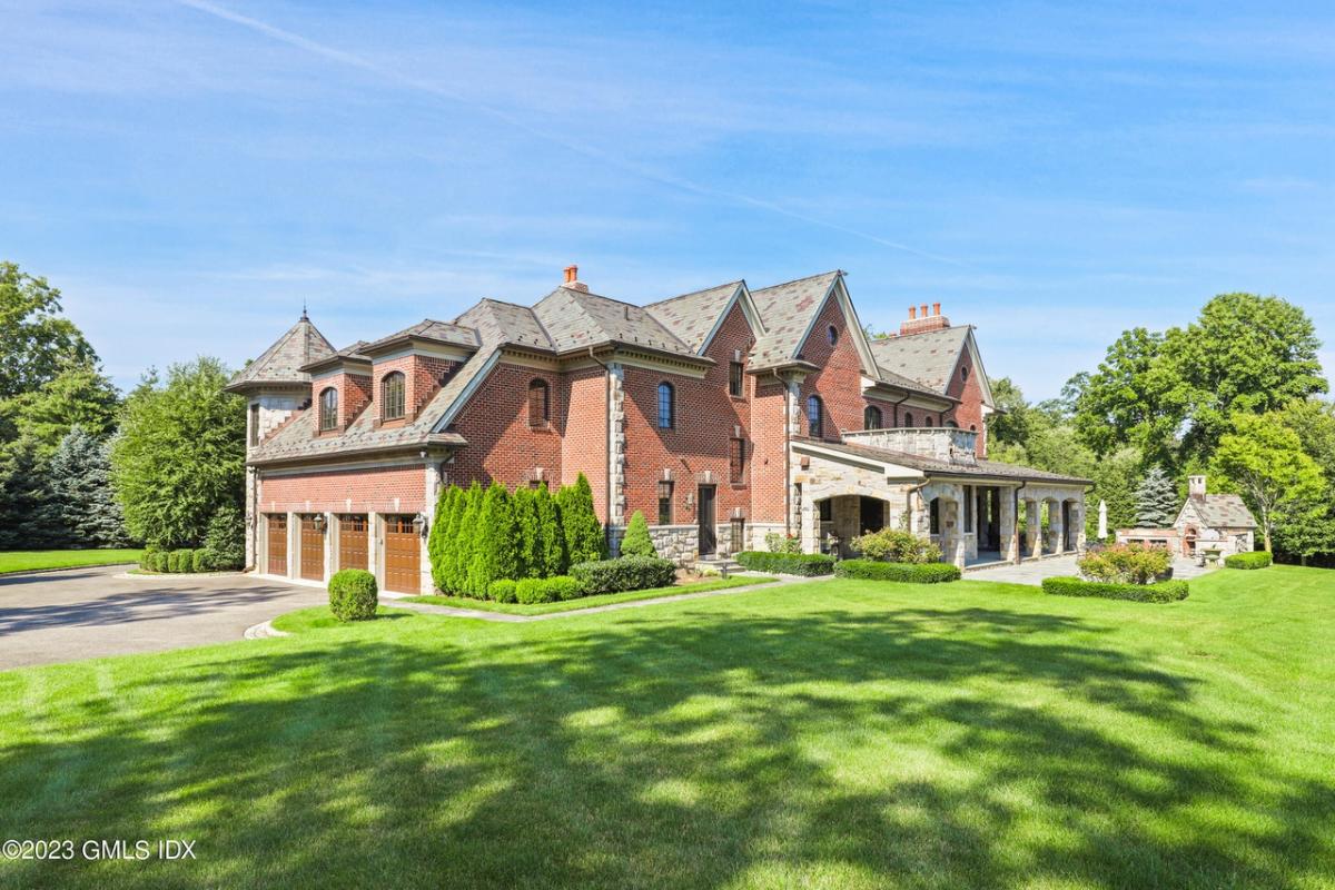 Distant view of the mansion with a garage.