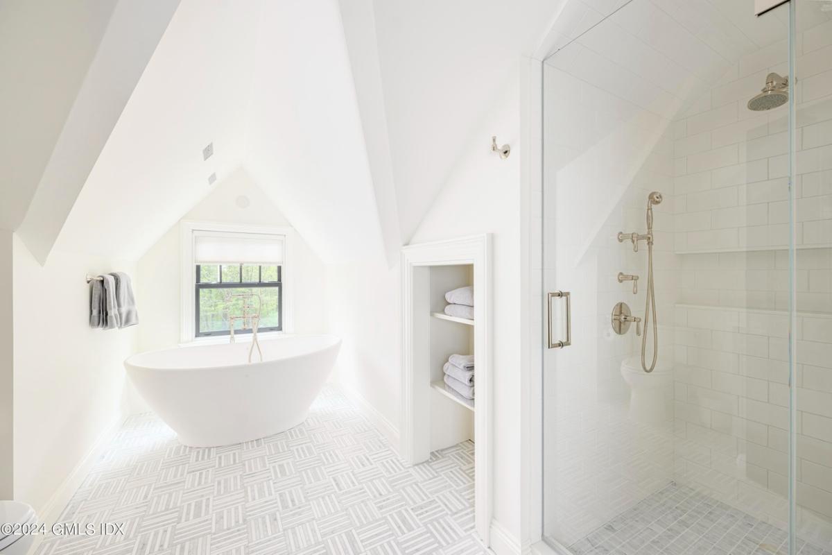 Bathroom with a soaking tub and a walk-in shower.