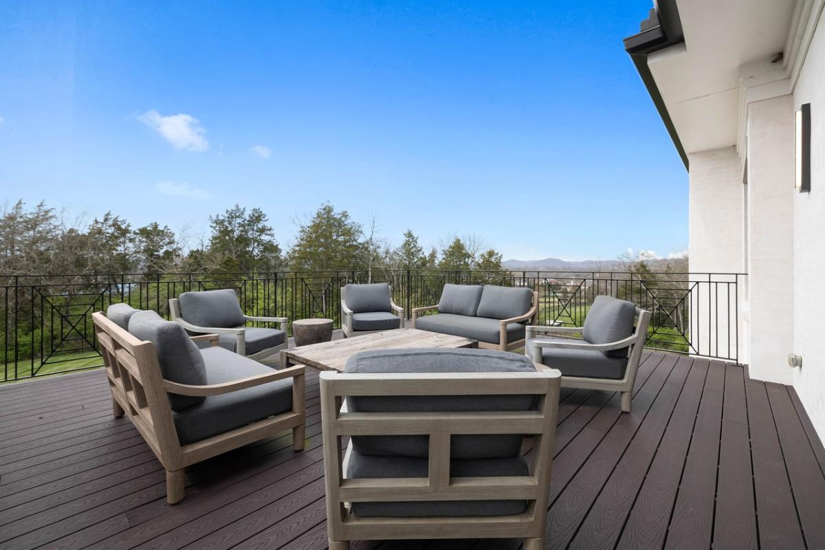 Balcony with a table and chairs.