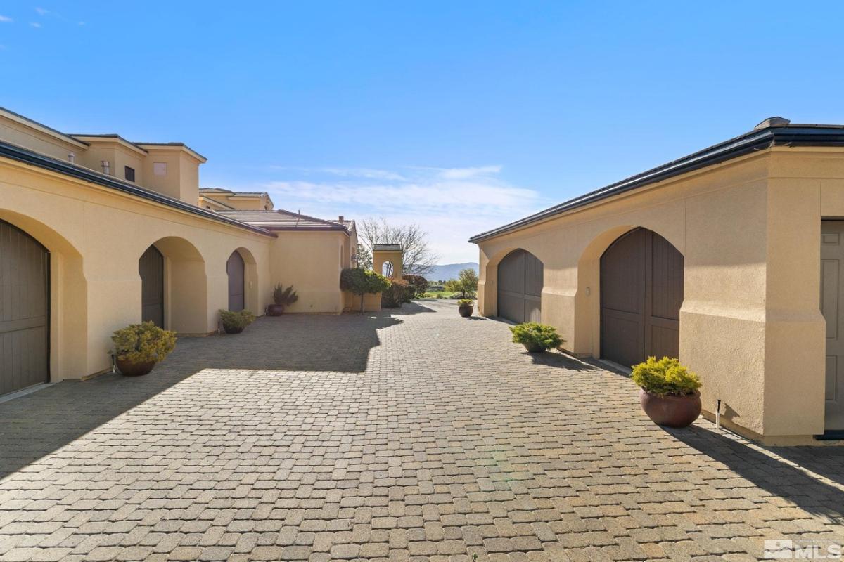 Garage with spacious driveway.