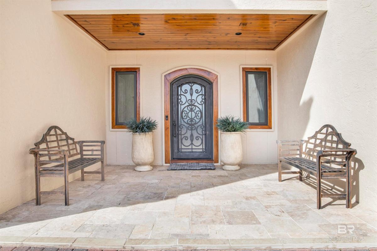 Front entry of the house with benches.