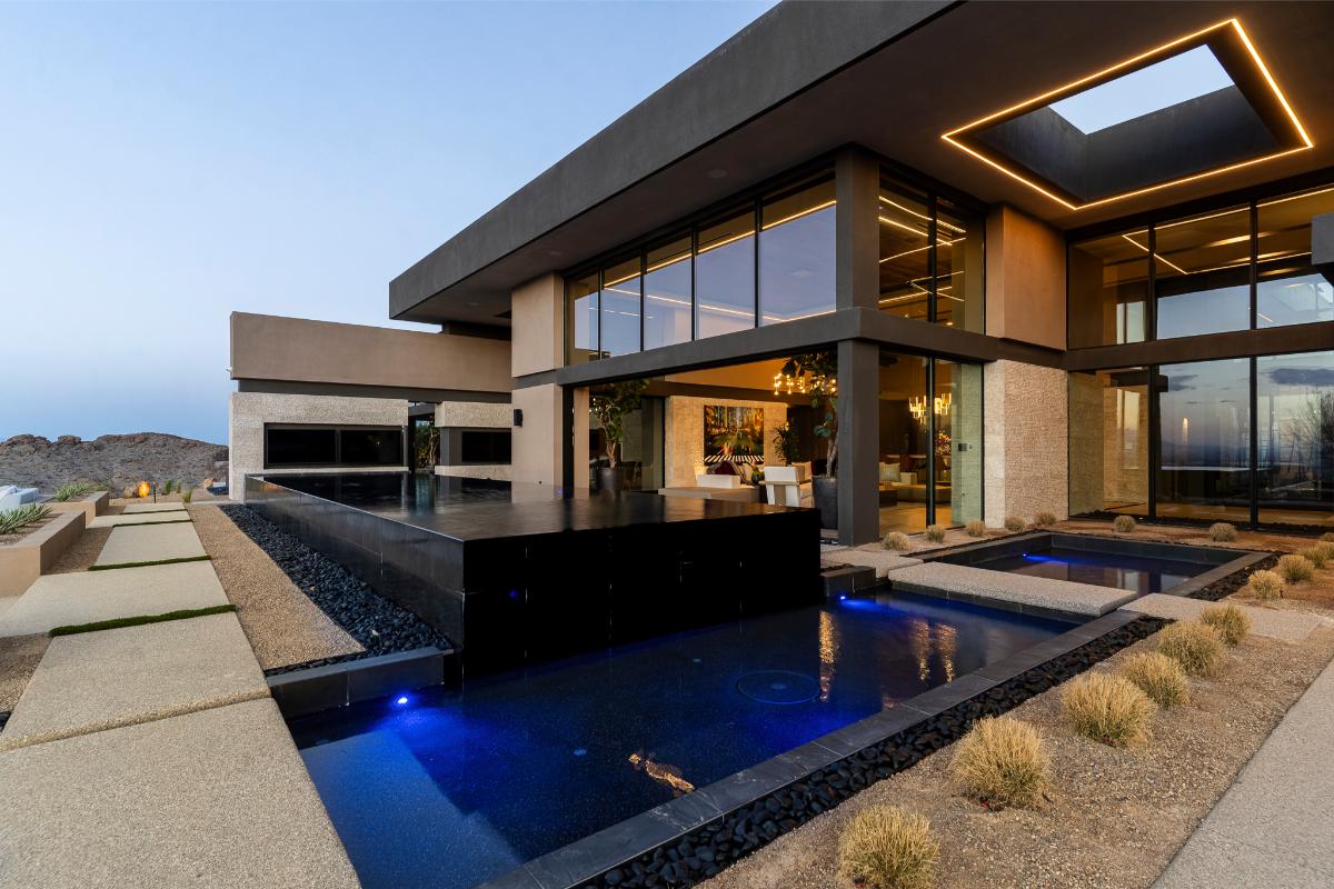 Backyard of the mansion with a pool.