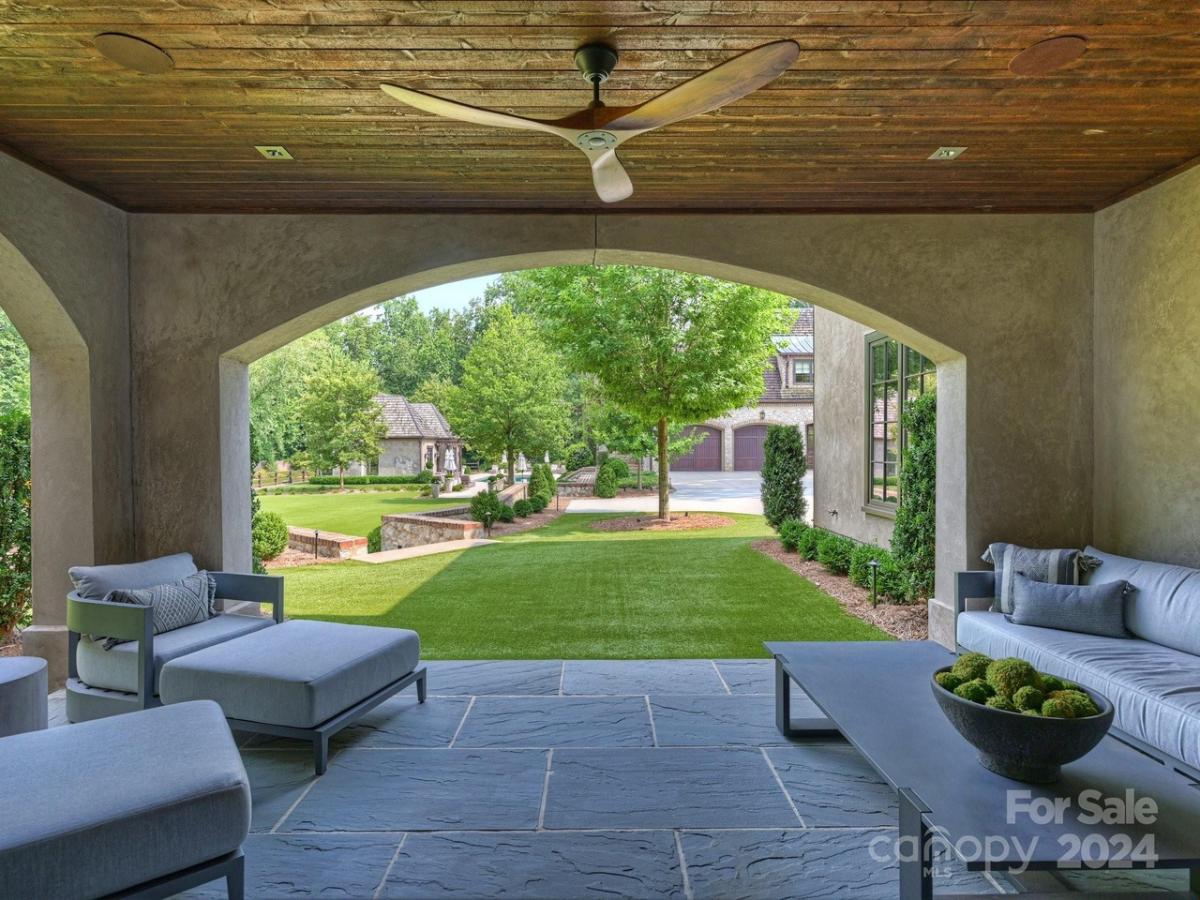 Covered patio with a table and chairs.
