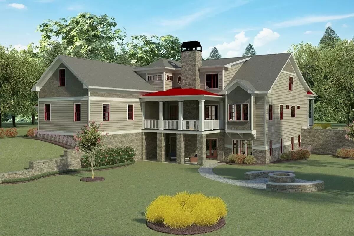 Rear view with stacked porches, a stone chimney, and framed windows.