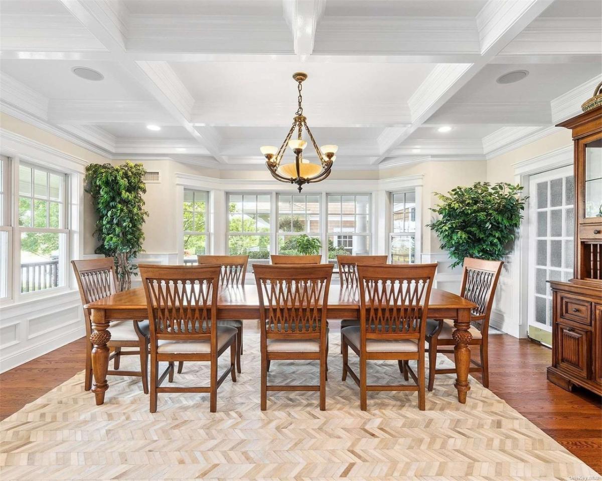 Dining room with wooden table and chairs.