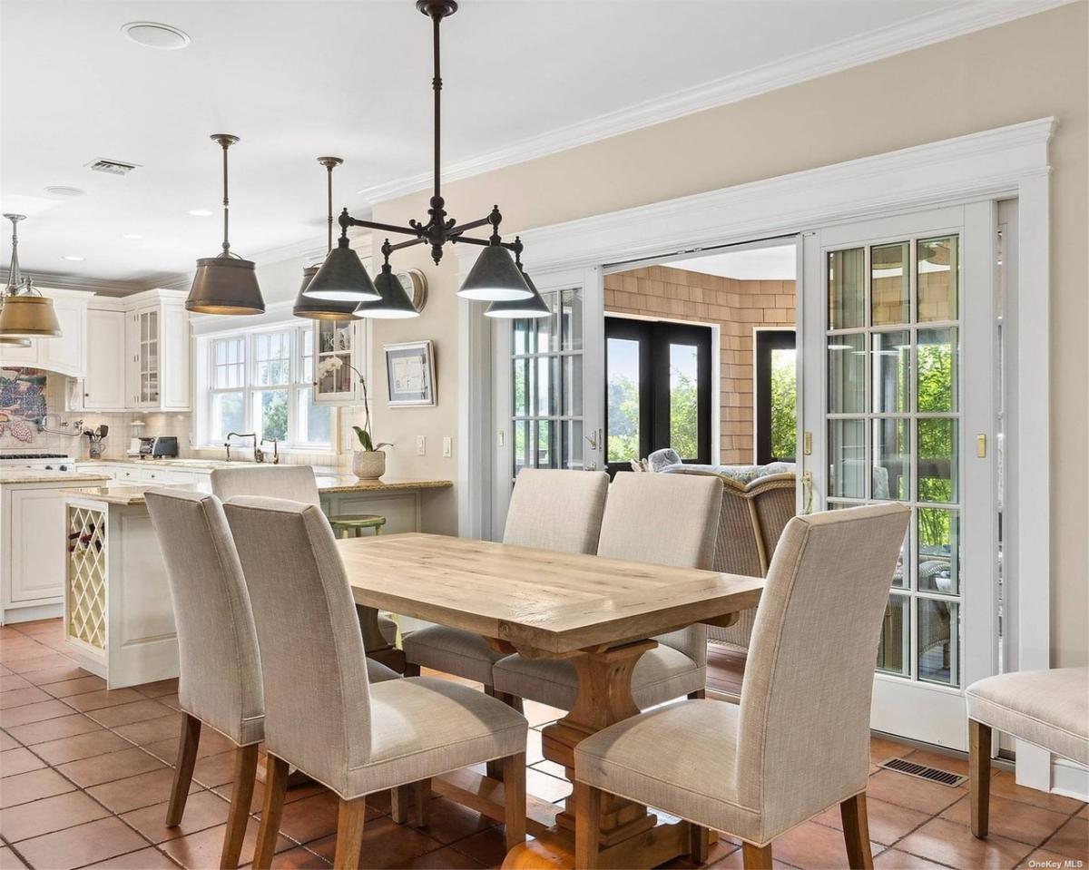 Breakfast nook with wooden table and chairs.