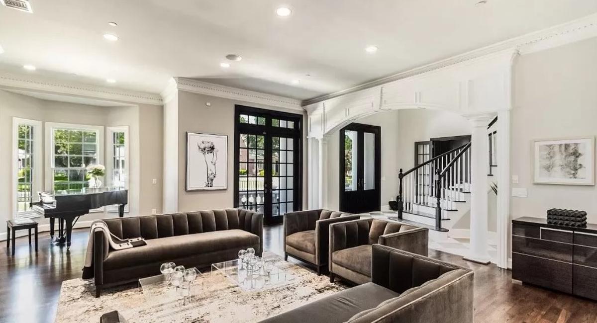 Living room with couches and glass table.