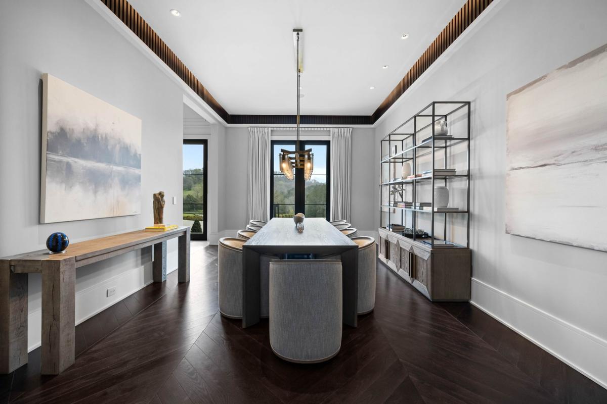 Dining room with a large wood table.