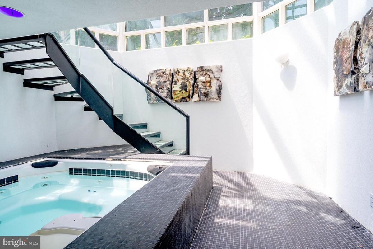 An indoor swimming pool with a staircase.