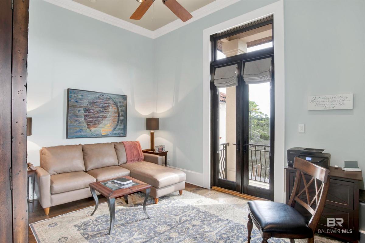 Sitting area with a couch and glass door.