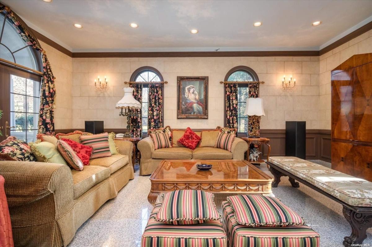 Living room with sofas and custom lighting.