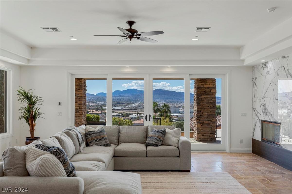 Living room with sofas and glass doors.