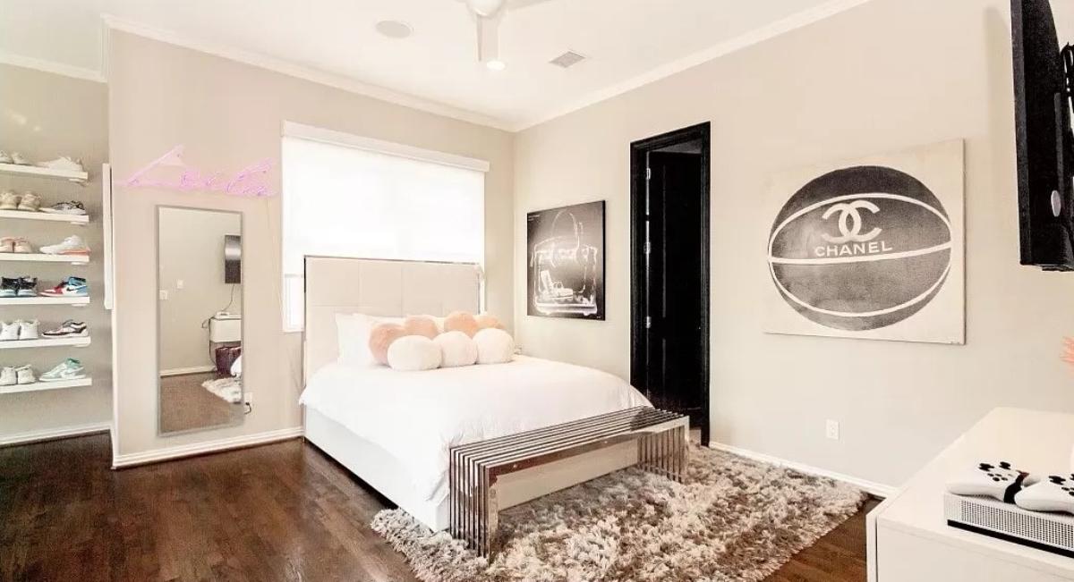 Bedroom with wood flooring.