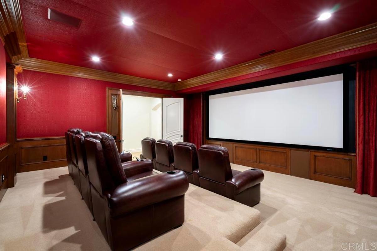 Home theater with carpet flooring.