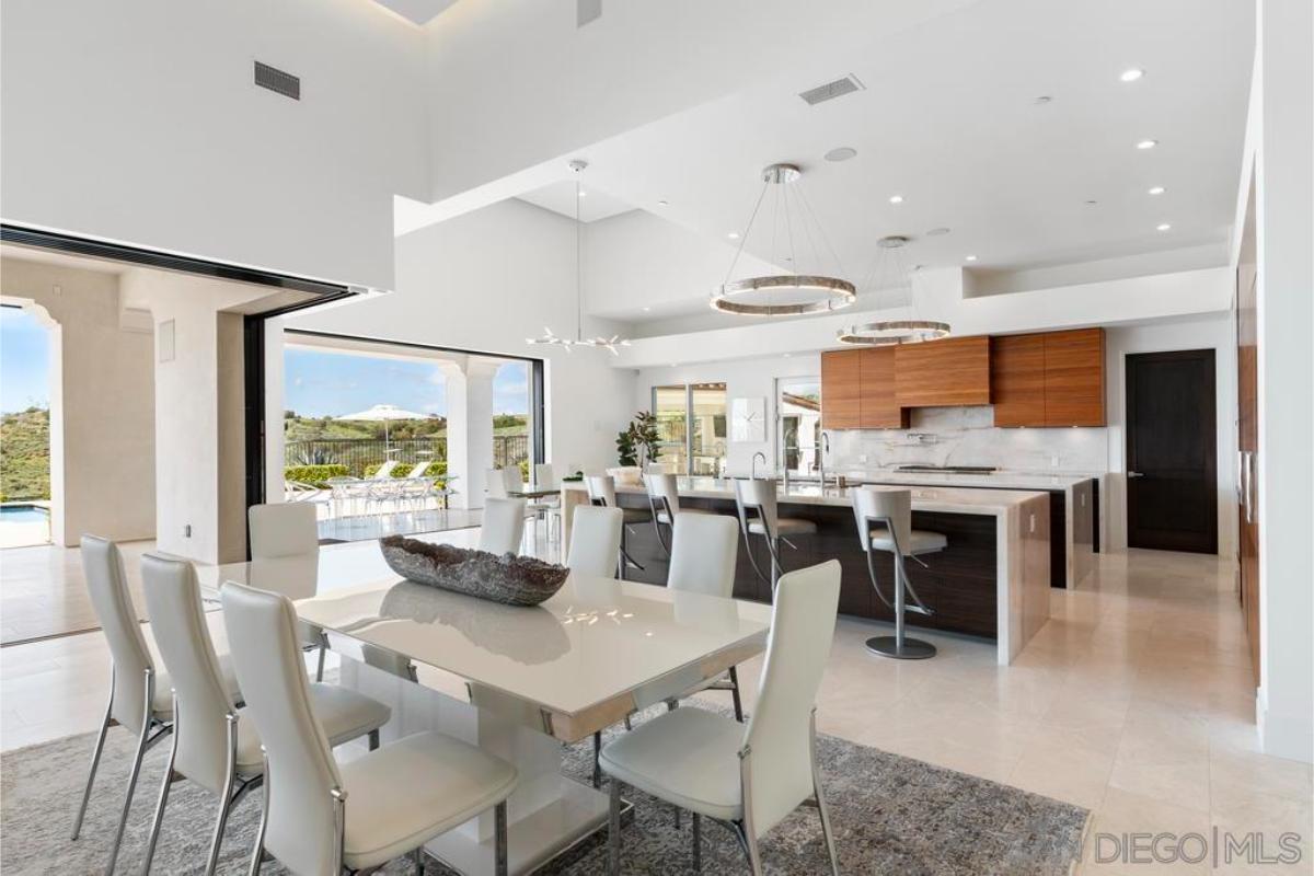 Dining room with a large table and chairs.