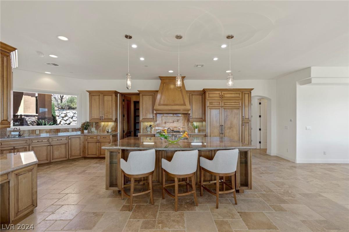 Kitchen with a large island and custom cabinetry.