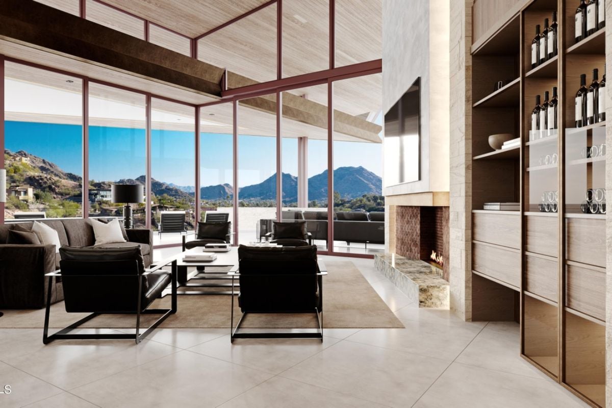 A living room with a tiled floor, fireplace, rug, couch, chairs, and center table.