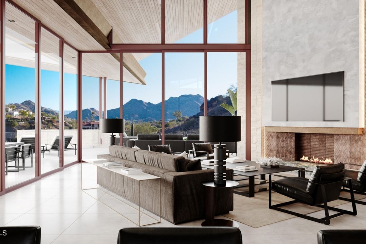 A living room with a tiled floor, fireplace, rug, couch, chairs, and center table.