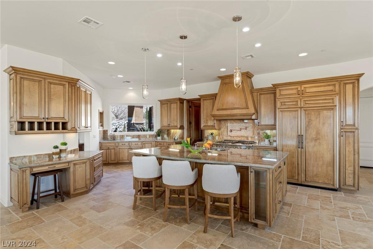 Kitchen with a large island and custom cabinetry.