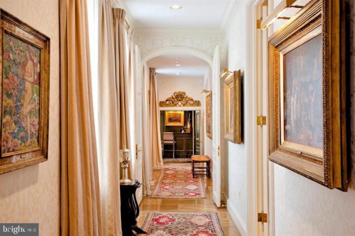 Hallway with paintings on the wall.