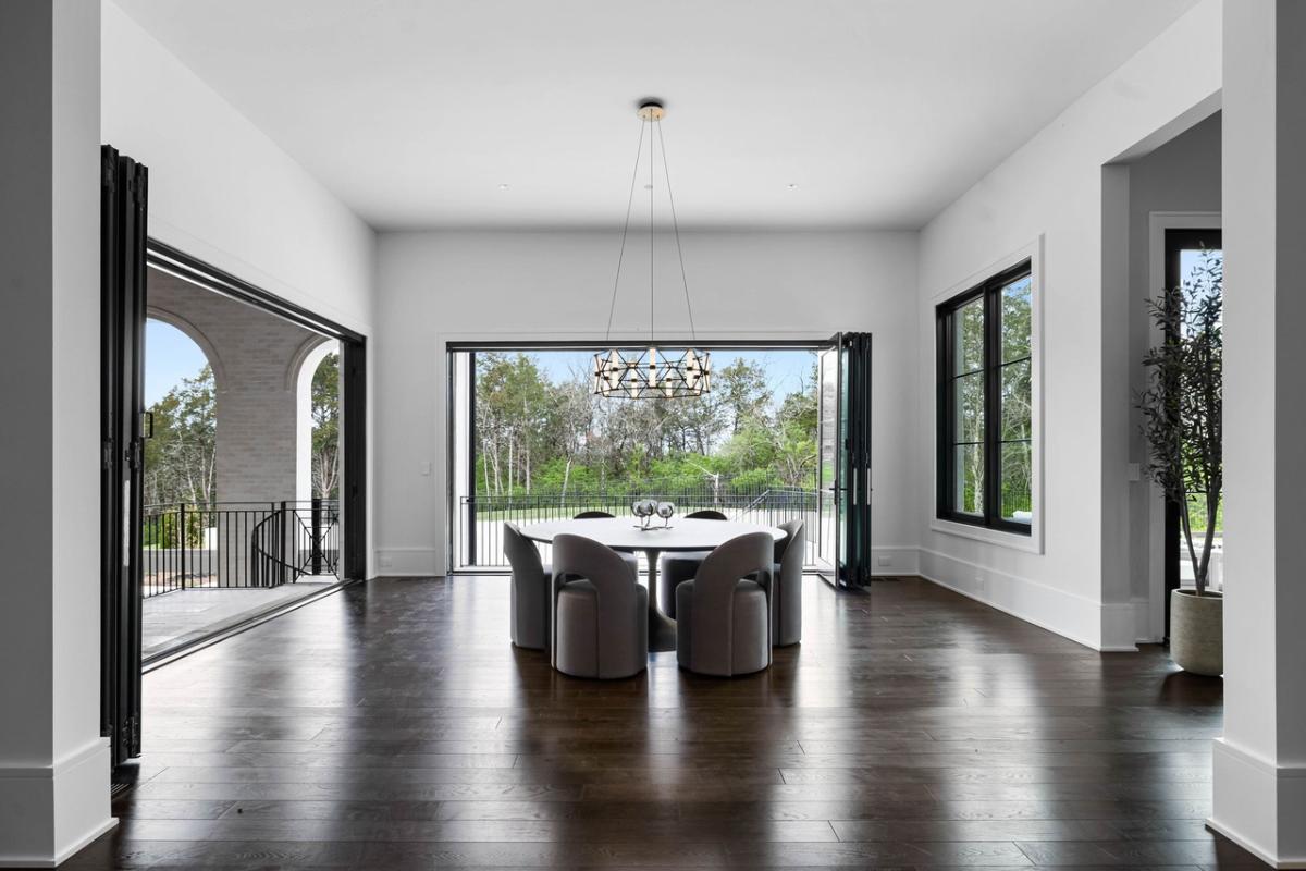 Breakfast nook with a chandelier and hardwood floors.