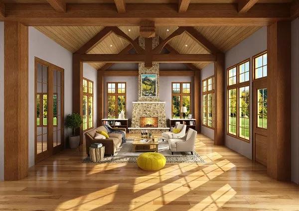 Living room with modern seats, a stone fireplace, and a cathedral ceiling adorned with exposed trusses.