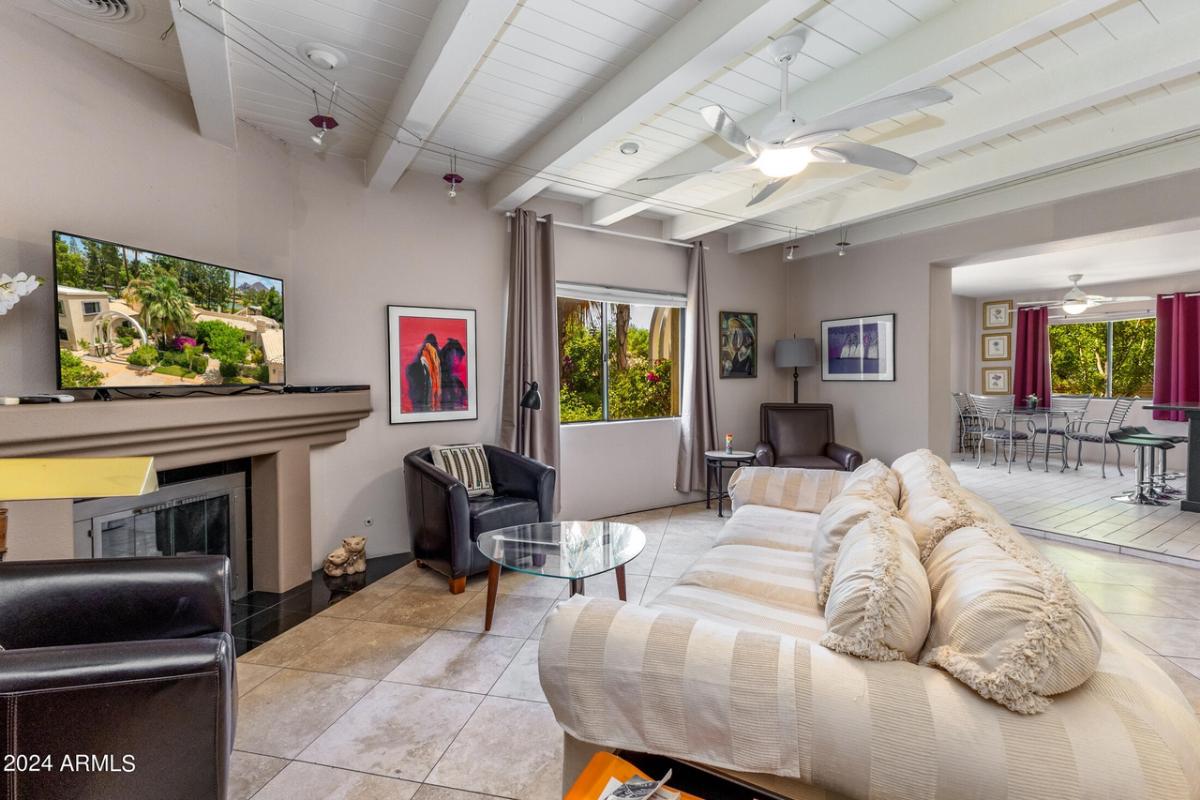 Sitting room with couches and a fireplace.