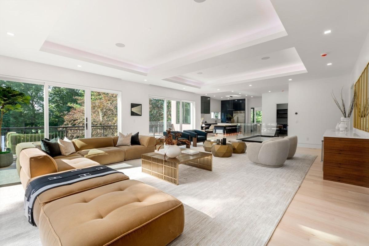 Living room with hardwood floor and sliding glass doors.