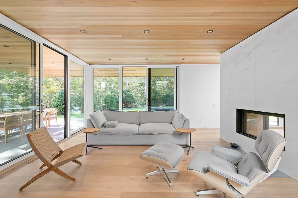 Living room with hardwood floor and sliding glass doors.
