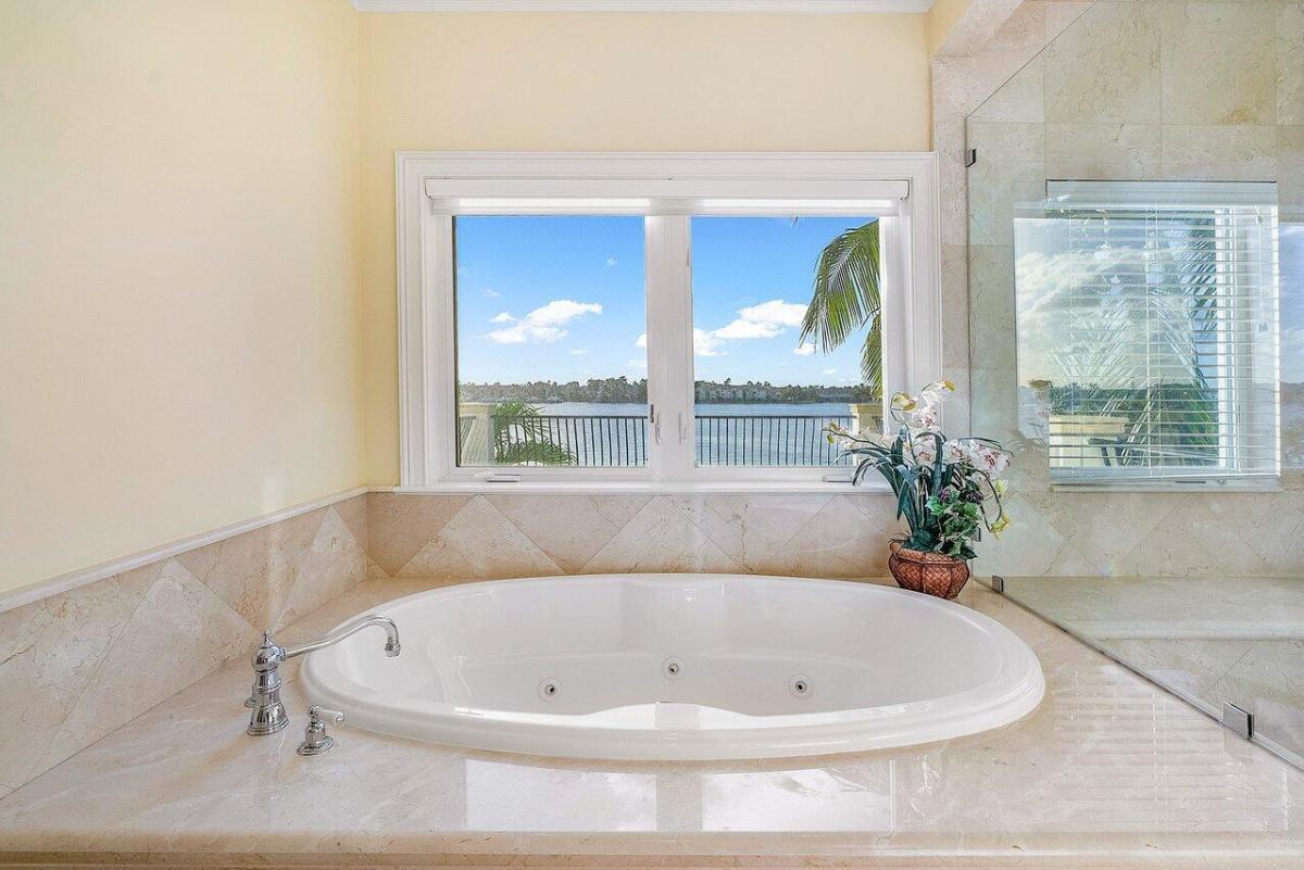 Bathroom with a soaking tub and a walk-in shower.