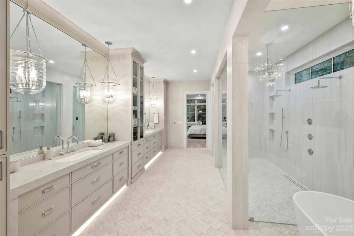 Bathroom with sinks, soaking tub and a walk-in shower.