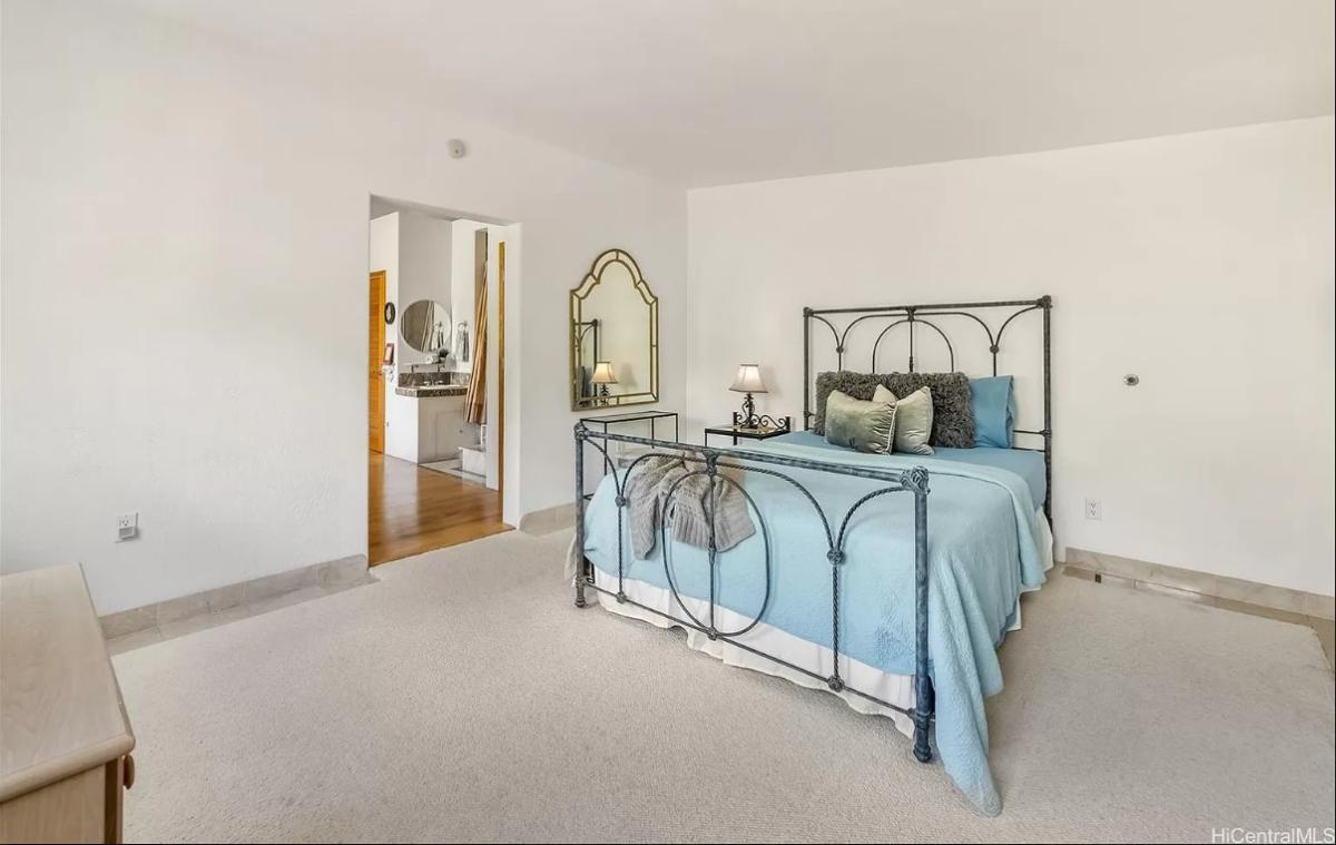 Bedroom with carpet flooring.