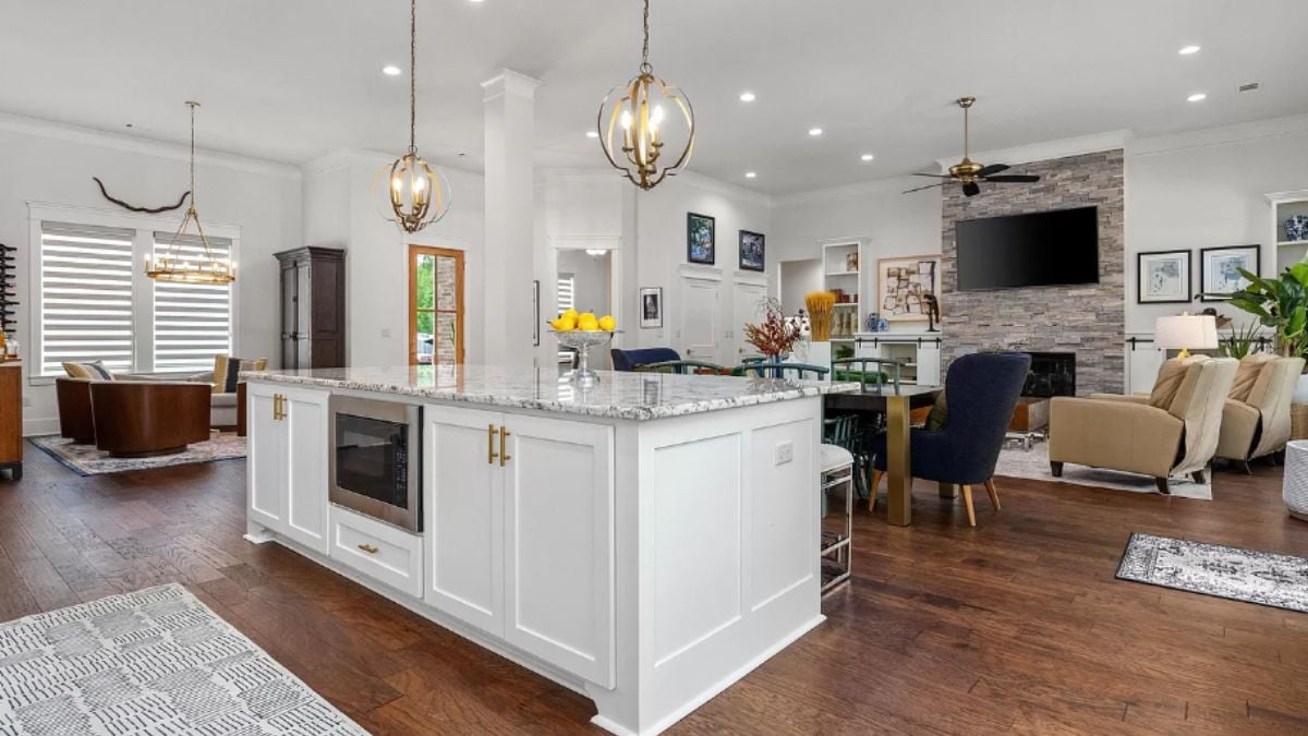 A great room with living space, a dining area, and a kitchen.