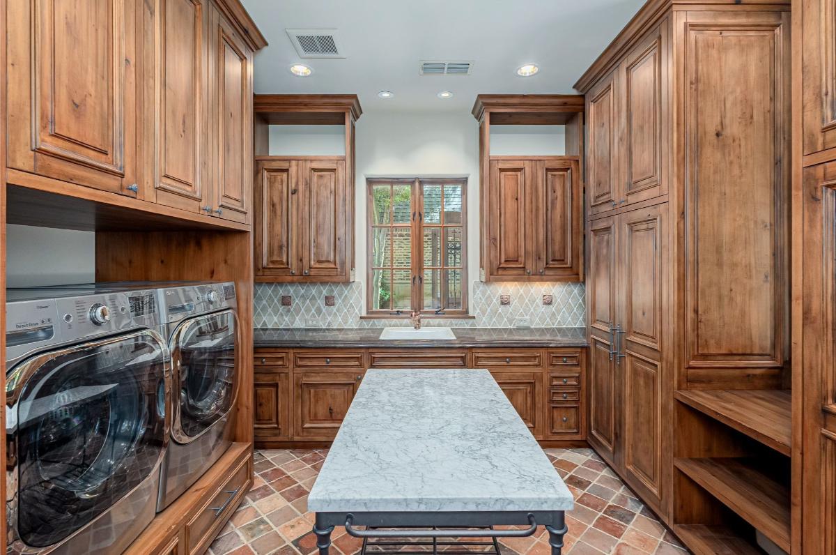 Laundry room with custom cabinetry.