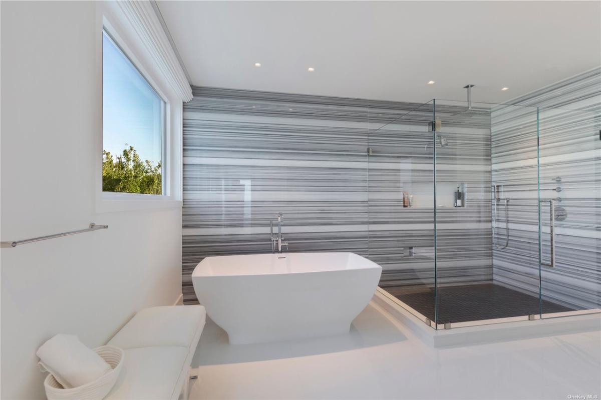 Bathroom with a soaking tub and a walk-in shower.