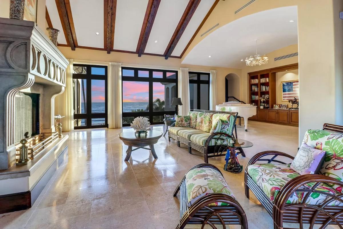 Living room with tile flooring and a fireplace.