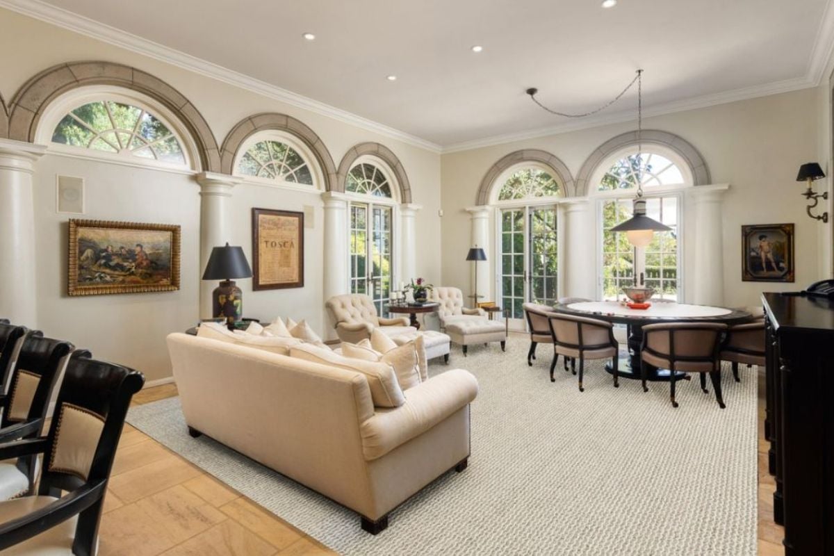 A great room with living space, a dining area, and a bar.