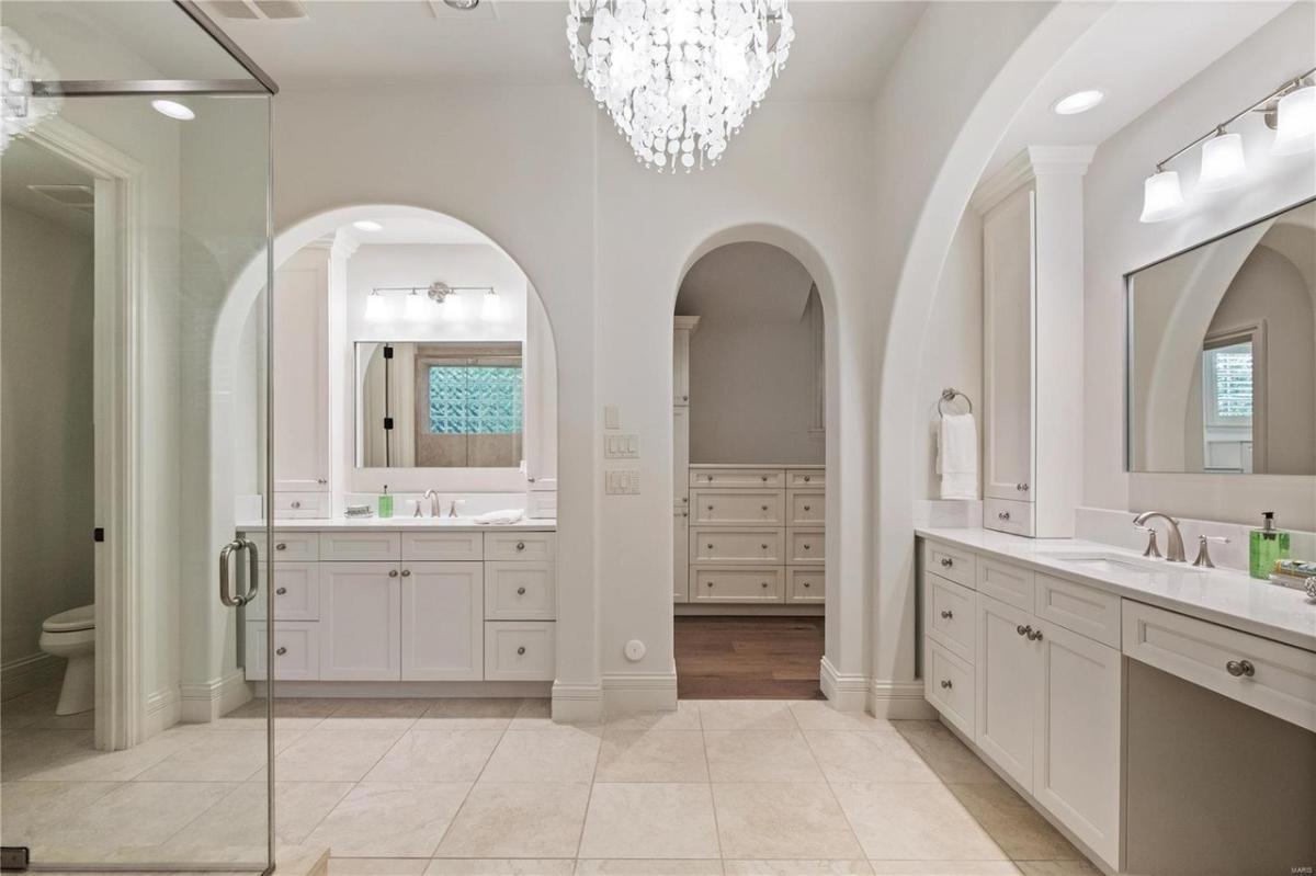 Bathroom with a sink, toilet and a walk-in shower.