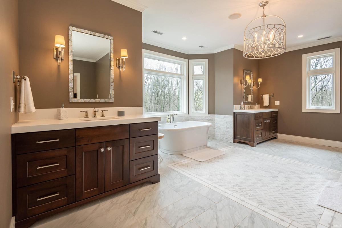 Bathroom with dual vanity and a soaking tub.
