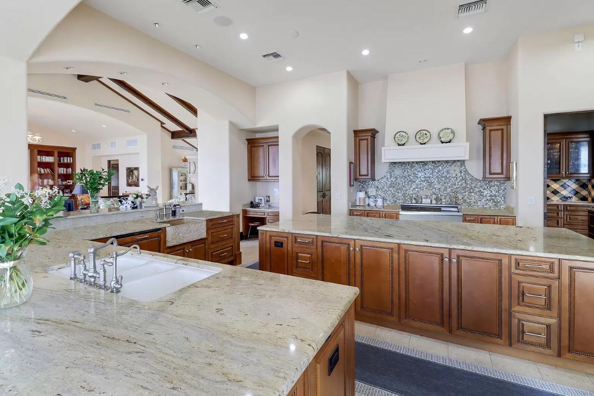 Kitchen with custom cabinetry and a center island prep area.