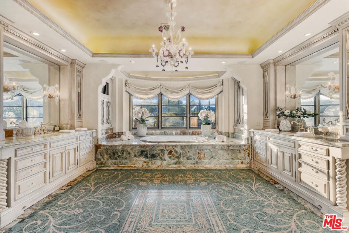 Bathroom with a custom-made vanities and a soaking tub.
