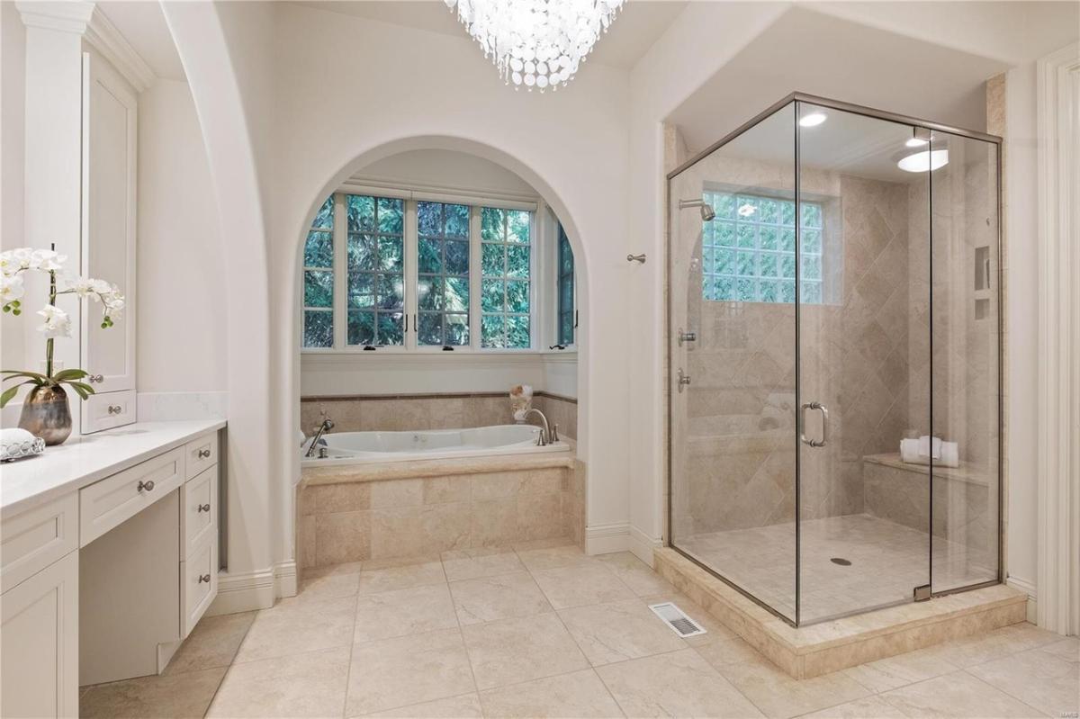 Bathroom with a sink, soaking tub and a walk-in shower.