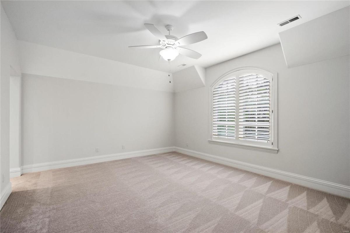 Bedroom with carpet flooring.