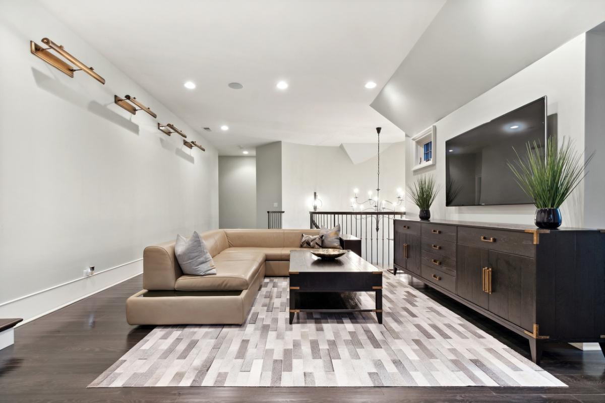 Family room with couches and a TV.